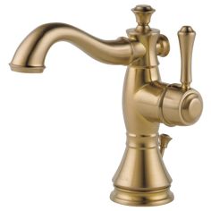 a faucet that is on the side of a white wall and has an open spout