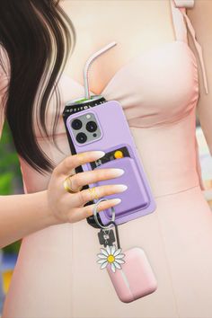 a woman in a pink dress holding a purple phone case with a flower on it