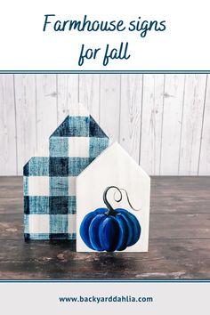 two paper pumpkins sitting next to each other on top of a wooden table with text overlay that says farmhouse signs for fall