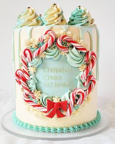 a cake decorated with candy canes and candies