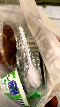 a plastic bag filled with food and utensils