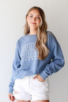 COMFORT WASH All DU Exclusive items are excluded from all coupons and promotions Calling all Suwanee residents, the Light Blue Suwanee Georgia Sweatshirt was made just for you! This comfy sweatshirt is designed with a soft and stretchy knit with a fleece interior. It features a crew neckline, long sleeves, a relaxed fit, and the words "Suwanee Georgia" on the front. Style the Light Blue Suwanee Georgia Sweatshirt with your favorite denim and sneakers for a casual look! Comfort Wash Soft + Stretc Georgia Sweatshirt, Blue Dress Accessories, Woodstock Georgia, Suwanee Georgia, Greenville South Carolina, Letter Sweatshirt, Exclusive Dress, Charleston South Carolina, Comfy Sweatshirt