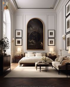 an elegant bedroom with white walls and paintings on the wall, along with two couches