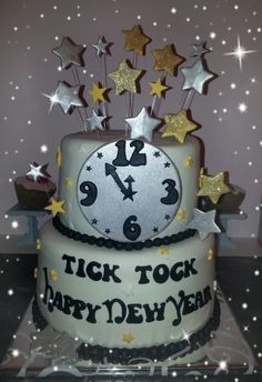 a birthday cake decorated with stars and a clock that says tick tock happy new year