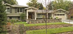 a house with landscaping in front of it