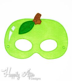 a green mask with a leaf on it