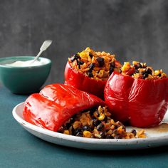 stuffed peppers with rice and beans on a plate