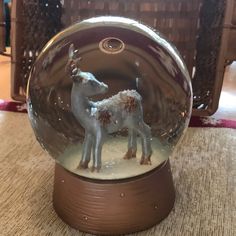 a snow globe with a deer in it