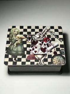 a checkered box with an image of alice and the rabbit on it