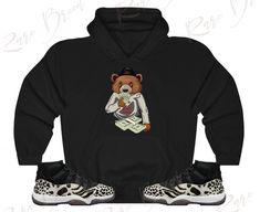 Custom Designed Sneaker Hoodie Hoodie Features 🔹 Drawstring Hood  🔹50% Cotton, 50% Polyester  🔹Runs True To Size  🔹Kangaroo Pouch Pocket Shoes Not Included Custom Made - Not Adidas, Nike, or Jordan Brand Sneaker Tee, Sneaker T-Shirt The sneakers/shoes are not being sold in this product. You are only purchasing the tshirt/hoodie/sock/sweatshirt/tank/hat/shorts top shown. Shoes are NOT included. The shoes displayed are sold separately elsewhere and are only used for marketing purposes. We are displaying the shoes to help you visually find the best item to match your sneakers! 📦 Delivery: While we anticipate that you will receive your items within about a week, the delivery for this item can take up 10-14 Business Days. If unforeseen circumstances arise and you have not received your ite Air Jordan 11 Animal Instinct, Pocket Shoes, Air Jordan Retro 13, Air Jordan Retro 11, Royal Blue Shirts, Jordan Retro 11, Animal Instinct, Orange Sneakers, Retro 11