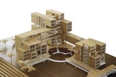 an architectural model of a building made out of wood