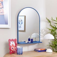 * Classic Arched Design * Handy Shelf - Max Load Weight is 2kg * Available in Multiple Colourways Elevate your home decor with our Arched Wall Mirror with Shelf, a contemporary twist on a classic design. This lovely mirror features a convenient shelf for displaying your favourite items. Available in multiple colourways, it complements any interior aesthetic. Arched Wall Mirror, Arched Design, Arched Wall, Wall Mirror With Shelf, Pastel House, Mirror With Shelf, Blue Home Decor, Interior Aesthetic, Elevate Your Home