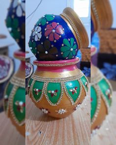 three different pictures of colorful vases with designs on the top one is gold, and the other is green