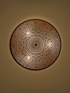 a circular object is shown in the middle of a brown and beige background with circles on it