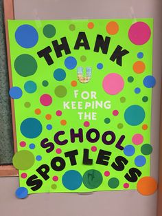 a green sign that says thank for keeping the school spotlights on it's door