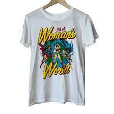 a white t - shirt with the words wonder world printed on it, and an image of