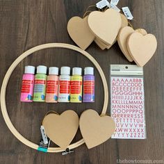 some crafting supplies are arranged on a wooden table and ready to be used in crafts