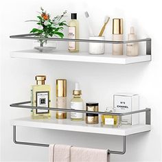 two white shelves filled with different types of beauty products and flowers on top of each shelf