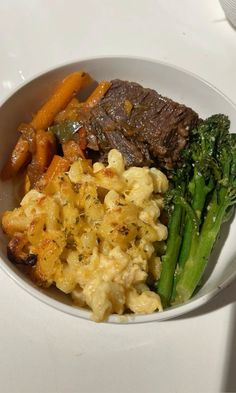 a white bowl filled with different types of food