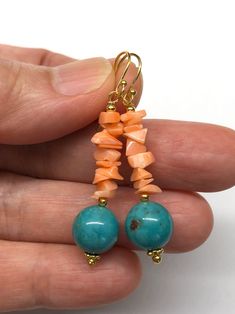 A pair of dangling earrings with genuine turquoise beads, decorated with genuine coral beads. - made with genuine turquoise beads, genuine coral, gold-plated sterling silver beads, gold-plated sterling silver wires and gold-plated sterling silver hooks - approximately 45 mm / 1.77 inches in length of the earrings - approximately 10 mm diameter of turquoise bead Visit my shop for more: http://www.etsy.com/ca/shop/RitaCollection If you have any questions regarding the item or my store in general, Diy Earrings Dangle, Donut Jewelry, Beachy Earrings, Diy Earrings Easy, Natural Stone Earrings, Silver Earrings Handmade, Coral Earrings, Coral And Gold, Funky Jewelry