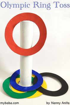 the olympic ring tosser is made out of toilet paper and some colored rubber rings