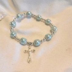 Exquisite Ladies' Charming Stretch Faux Pearl Beads Cross Bracelet Color: Please See Picture Length: About 7 Plus Stretch Items Condition: 100% Brand New!! A Perfect Gift For A Special Person, A Friend Or For Yourself! I Am Completely And Madly In Love With Making Jewelry! I Have Eclectic Tastes, And Love Simple, Dainty And Delicate Pieces Of Jewelry That Can Be Worn Every Day. Creating Custom Pieces Is Always Challenging And Rewarding, So Please Do Feel Free To Contact Me With Any Custom Silver Pearl Bracelets With 8mm Beads, Silver Beaded Pearl Stretch Bracelet, Adjustable Blue Pearl Beaded Bracelets, Silver Beaded Pearl Bracelets, Pearl Beaded Bracelets With Silver Beads, Adjustable Silver Beaded Rosary Bracelet, Pearl Beaded Rosary Bracelet With Round Beads, Christian Bracelets, Beaded Leather Bracelet