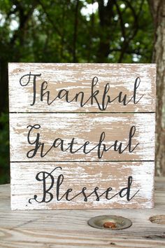 a wooden sign that says, thank grateful blessed