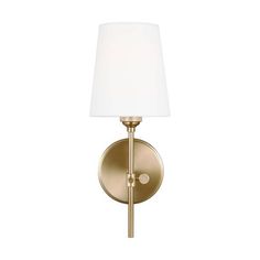 a gold wall light with a white shade on the top and bottom half of it