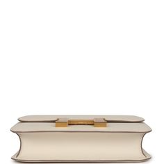 the box clutch in cream leather with gold hardware