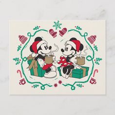 two mickey and minnie mouses are sitting together on christmas day with presents in front of them