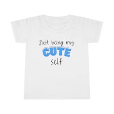 What the perfect gift for your toddlers? This effortless statement merch that says, 'Just Being My Cute Self' is the most adorable present you can ever gift to your kids, nephews, and nieces this coming Christmas season! This cute design comes in blue and pink for boys and girls respectively, printed in shirts, hoodies, caps, tote bags, and mugs. Product Information: Gildan 64500P *100% Ringspun cotton (fiber content may vary for different colors) *Light fabric (4.5 oz/yd² (153 g/m *Classic Fit *Grey pearlized tear-away label Care Instructions:  *Machine wash: cold (max 30C or 90F) *Non-chlorine: bleach as needed. *Tumble dry: low heat; Iron, steam or dry *Do not dry clean. If you like this Toddler T-shirt please check out our store for other designs. We're hard at working  adding new desi Top Baby Products, Christmas Gifts For Kids, Gender Neutral Baby, Christmas Seasons, Cute Designs, Gifts For Kids, Boy Or Girl, Baby Clothes, Kids Outfits