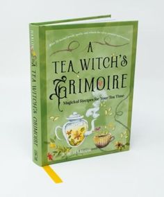 a green book with the title tea witch's grimoire