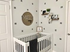 a baby's room decorated in black and white