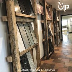 a long hallway with wooden shelves and tile flooring