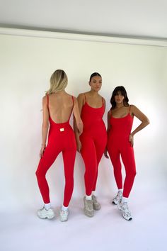 Our Mackenzie Belted Bodysuit is a retro athleisure piece featuring a thick belted trim waistline in a ruby red coloring and vertical side panel seams that contour any shape. Signature low back detail Belted waistline detail for form fitting shape Dainty, supportive, adjustable straps Removable padding Inseam length on size S: 27" Made of our VERSA fabric: smooth, buttery, and form fitting 85% polyamide, 15% spandex Your order will ship from our warehouse in FL, USA! Red Gym Outfit, Retro Athleisure, Dance Audition, Fitted Jumpsuit, Iu Fashion, Red Jumpsuit, Moving Sale, Fitness Studio, Waist Pants