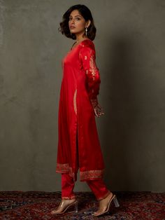 Editor's Note Elevate your ethnic look with our red ari-hand embroidered girija kurta, paired with churidar and a coordinating dupatta. This ensemble combines traditional charm with intricate hand embroidery, perfect for special occasions and celebrations. Fabric: Silk satin Color: Red Components: Kurta, churidar and dupatta Occasion: Festive Note: Product colour may slightly vary due to photographic lighting sources Care: Dry clean only About the DesignerRi Ritu Kumar is one of India’s foremost Churidar With Resham Embroidery In Art Silk, Chanderi Kurta With Resham Embroidery For Navratri, Cotton Silk Straight Kurta With Embroidered Border, Art Silk Churidar With Resham Embroidery, Straight Kurta Churidar With Resham Embroidery In Art Silk, Straight Chanderi Kurta With Embroidered Border, Bollywood Style Sets With Resham Embroidery And Straight Kurta, Straight Kurta Salwar Kameez With Embroidered Border, Designer Palazzo Set With Embroidered Border