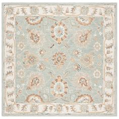 an area rug with various colors and designs on the carpet, including blue, beige, orange