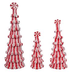 three red and white christmas trees made out of candy canes on a white background