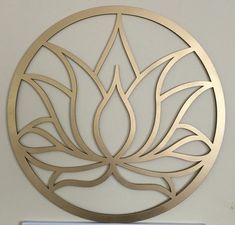 there is a metal plaque on the wall with a lotus symbol in it's center