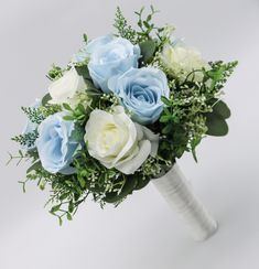 a bridal bouquet with blue and white flowers