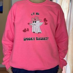 "Y Mi Spooky Basket?" in English translates to, "And My Spooky Basket?"  -unisex heavy blend crewneck sweatshirt is made from polyester and cotton.  -collar is ribbed knit, so it retains its shape even after washing -no itchy side seams on these sweaters -cozy and soft feel - double-needle stitching at the shoulder, armhole, neck, waistband, and cuff seams add top-tier durability.  - pearlized tear-away label.  Sizing:  Guide in centimeters/inches is pictured.  I would recommend sizing up for a baggier fit. Women's Sizes are true to size.  I would personally size up in the Men's, for a TRUER fit. (ex. Size Medium if you're a Small) Please allow up to 7 business days for production.  Please message me with any questions you may have and do not hesitate. Pink Screen Print Sweatshirt For Fall, Pink Crew Neck Sweatshirt For Halloween, Pink Crew T-shirt For Fall, Pink Crew Neck T-shirt For Fall, Spooky Basket, Halloween Cute Ghost, Halloween Cute, Cute Ghost, Baggy Fits