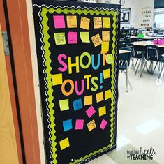 a classroom door decorated with post it notes and the words show out is written on it