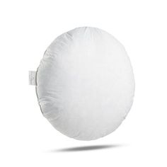 a white round pillow on a white background