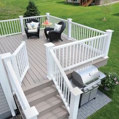 an outdoor deck with chairs and grill on it