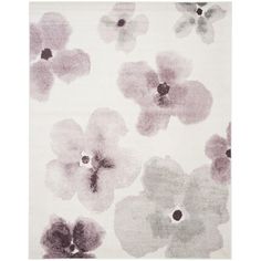 a white rug with purple flowers on it