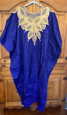 Rich royal blue authentic  African cotton Kaftan with gold embroidery excellent condition,  looks unworn! Free size  Plus size Measures approx: 50" Width  x 55" Length Blue Embroidered Kaftan For Ceremonial Occasions, Embroidered Blue Kaftan For Ceremonial Occasions, Elegant Blue Agbada For Ceremonial Occasions, Gold Embroidered Kaftan For Ceremonial Occasions, Royal Embroidered Kaftan For Festive Occasions, Royal Embroidered Traditional Wear In Royal Blue, Royal Blue Traditional Wear For Ceremonial Occasions, Eid Blue Traditional Wear With Gold Embroidery, Blue Traditional Ceremonial Kaftan