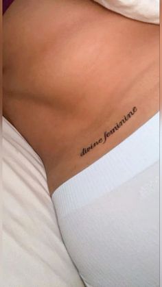 the back of a woman's stomach with an inscription on it that says, you are