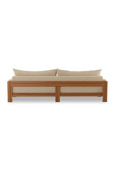 a wooden couch with two pillows sitting on it's back end and one arm