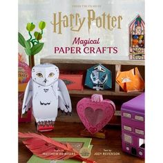 the book cover for harry potter's magic paper crafts is displayed on a table