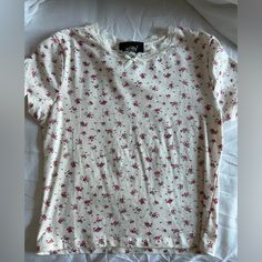 -Just Polly Pink Floral Coquette Top -Perfect Condition, Never Worn -Size M But Can Fit A Small Too -Lace Trimming And Bow Detail On Neckline Trendy Cream Floral Print Tops, Fitted White T-shirt With Floral Print, Casual Cream Floral Print Top, Casual Cream Tops With Floral Print, Coquette Top, Pink Floral Top, Florida Trip, Floral Crop Tops, Floral Top